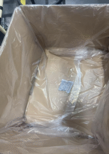 Lay flat dust-proof bags inside the cardboard box